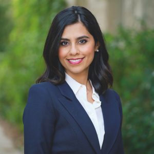 smiling woman in blue coat
