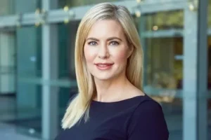 smiling woman in dark blue shirt