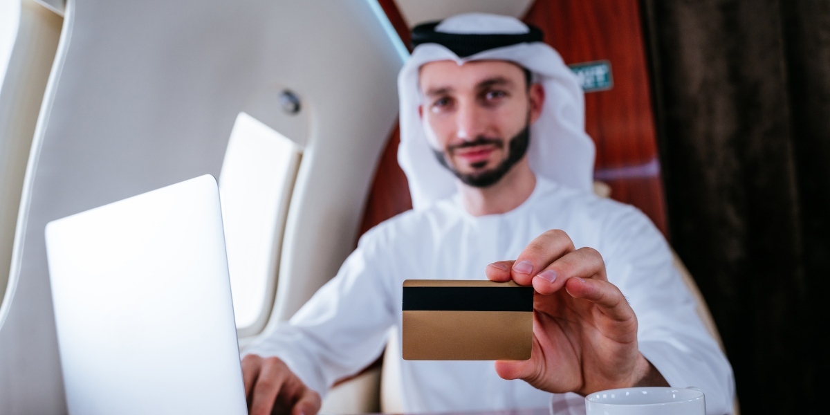 arab man holding a card